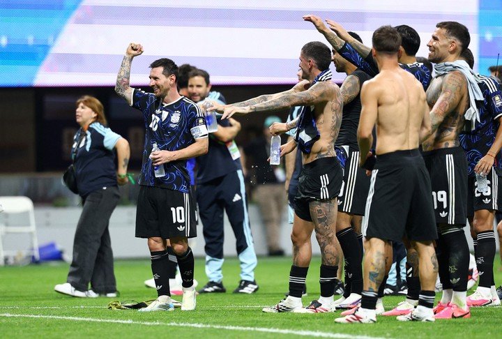 Argentina's Lionel Messi and teammates celebrate after the match (Reuters).